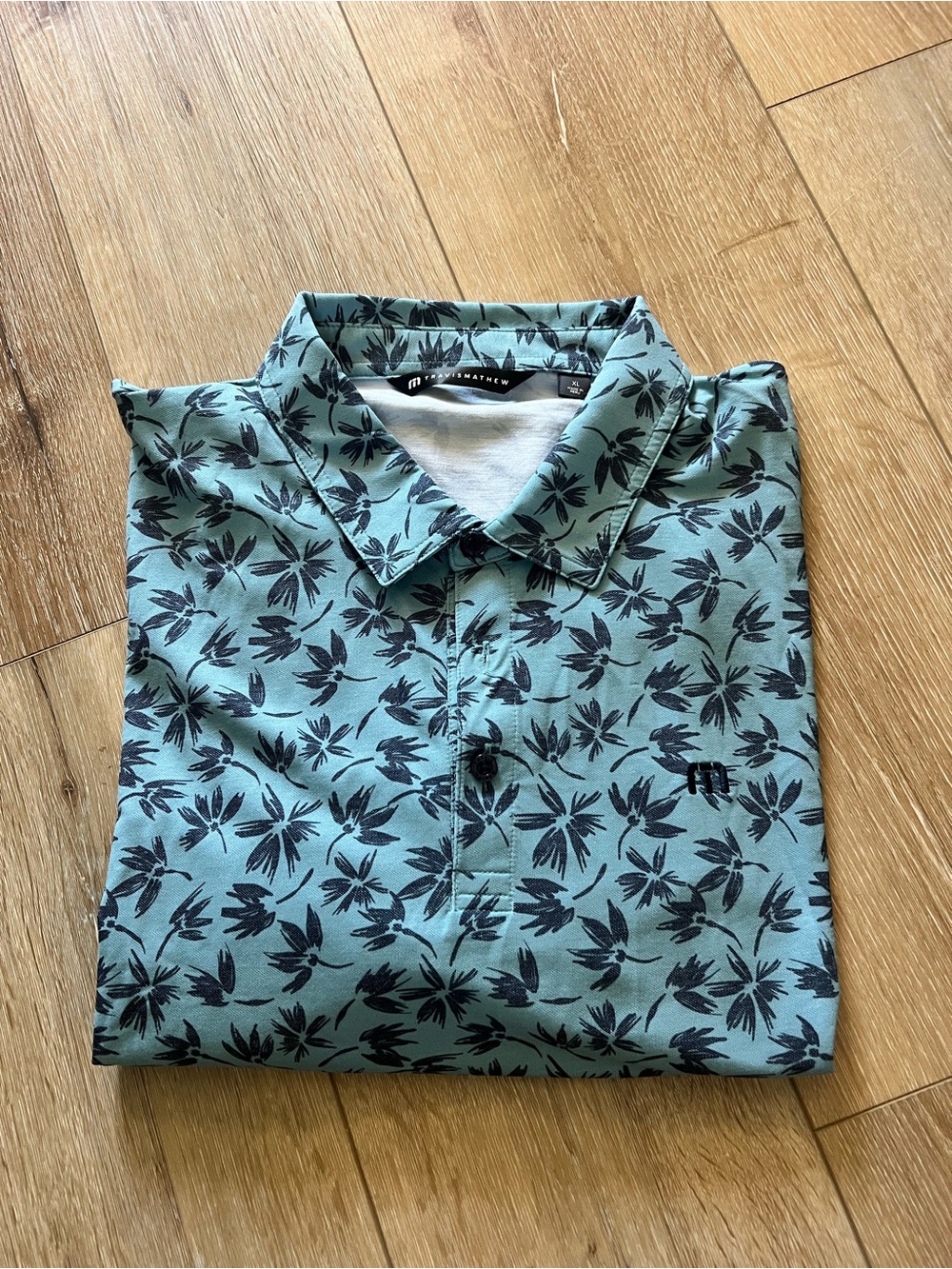 Travis Mathew Teal Polo with Black Floral Print